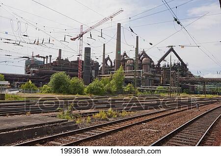 Volklinger Hutte (Volklingen Ironworks), as seen from the train station, Volklingen, Germany View Large Photo Image Stock Photo - Volklinger Hutte (Volklingen Ironworks), as seen from the train station, Volklingen, Germany. Fotosearch