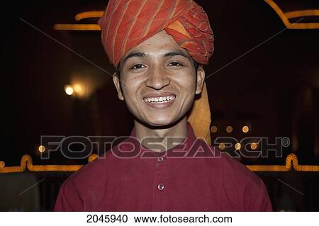 Stock Image - Waiter At Castle Mandawa, Rajasthan, India. Fotosearch