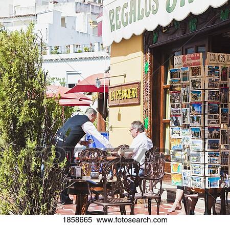 Waiter Serving Patron, Marbella, Malaga, Costa Del Sol, Spain View Large Photo Image Stock Photography - Waiter Serving Patron, Marbella, Malaga, Costa Del Sol, Spain. Fotosearch