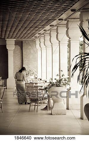 Waitress Setting Table In Restaurant, Toned Image View Large Photo Image Stock Image - Waitress Setting Table In Restaurant, Toned Image. Fotosearch