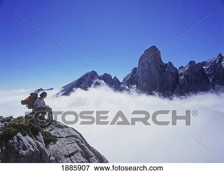Walker Above The Clouds Looking Over Mt. Bulnes De Naranja View Large Photo Image Stock Photo - Walker Above The Clouds Looking Over Mt. Bulnes De Naranja. Fotosearch