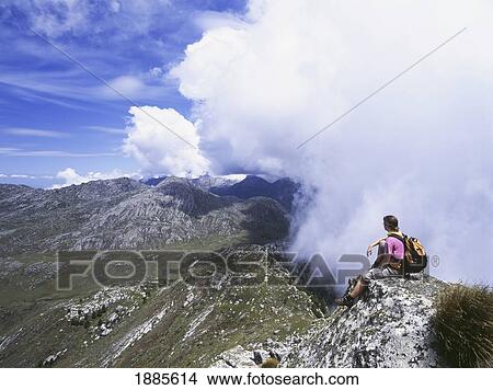 Picture - Walker Admiring View From Namasile Peak. Fotosearch