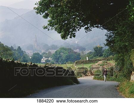 Walker Climbing Up Road Above Ambelside View Large Photo Image Stock Image - Walker Climbing Up Road Above Ambelside. Fotosearch