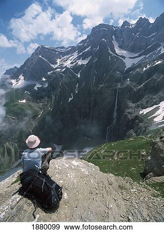 Walker Resting And Admiring The View Across The Cirque De Gavarnie To The Highest Waterfall In Europe View Large Photo Image Stock Photo - Walker Resting And Admiring The View Across The Cirque De Gavarnie To The Highest Waterfall In Europe. Fotosearch