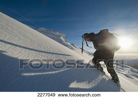 Walker with ice axe going through heavy snow up Beinn Respiol, Ardnamurchan peninsula; Highlands, Scotland View Large Photo Image Stock Photo - Walker with ice axe going through heavy snow up Beinn Respiol, Ardnamurchan peninsula; Highlands, Scotland. Fotosearch