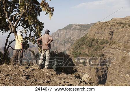 Walkers at viewpoint, near Chennak, Simien Mountains National Park; Amhara region, Ethiopia View Large Photo Image Stock Photo - Walkers at viewpoint, near Chennak, Simien Mountains National Park; Amhara region, Ethiopia. Fotosearch