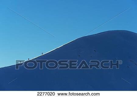 Walkers climbing snowy ridge of Sgorr Dhearg in winter near Glen Coe; Highlands, Scotland View Large Photo Image Stock Image - Walkers climbing snowy ridge of Sgorr Dhearg in winter near Glen Coe; Highlands, Scotland. Fotosearch