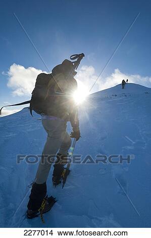 Picture - Walkers climbing the snowy slopes of Sgorr Dhearg near Glen Coe; Highlands, Scotland. Fotosearch