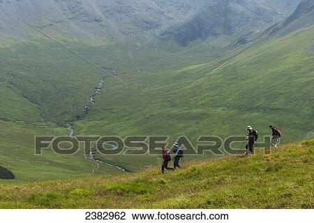Stock Image - Walkers in the Black Cuillin; Isle of Skye, Scotland. Fotosearch