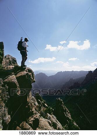 Stock Photo - Walking Admiring View Of Mountains, Capo D'orto. Fotosearch