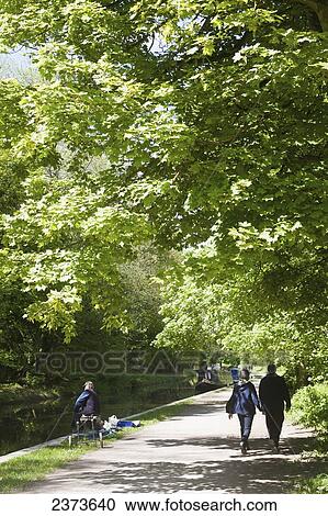Walking along path next to Kennet and Avon Canal; Wiltshire, England View Large Photo Image Stock Image - Walking along path next to Kennet and Avon Canal; Wiltshire, England. Fotosearch