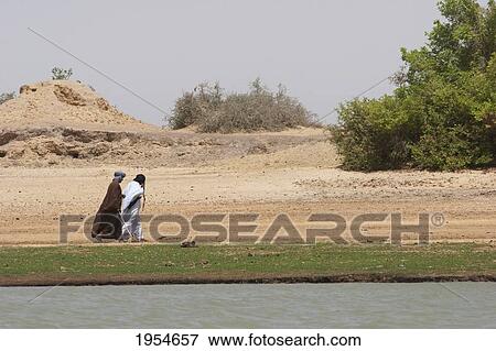 Stock Photo - Walking along the shores of the Niger River between Niafunke and Kabara, Mali. Fotosearch