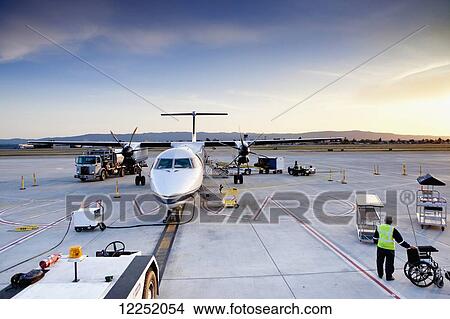 Picture - Walking off the plane and onto the tarmac at the Norman Y. Mineta San Jose International Airport; San Jose, California, United States of America. Fotosearch
