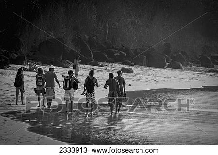 Stock Image - Walking On Beach In Praia Da Conceicao, Unesco World Heritage Site; Praia Da Cachorro, Fernando De Noronha, Pernambuco, Brazil. Fotosearch