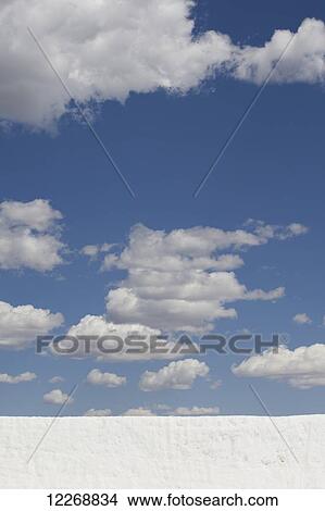 Wall of snow with puffy clouds and blue sky above, Park City, Utah, USA View Large Photo Image Picture - Wall of snow with puffy clouds and blue sky above, Park City, Utah, USA. Fotosearch