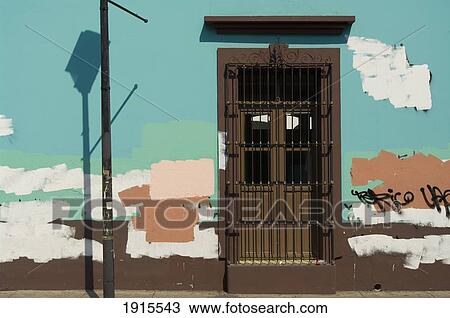 Stock Image - Wall With Closed Door And Graffiti. Fotosearch
