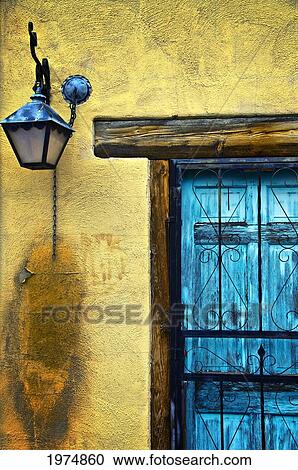 Stock Image - Walls And Details I, New Mexico, Details Of Old Blue Door And Yellow Wall.. Fotosearch