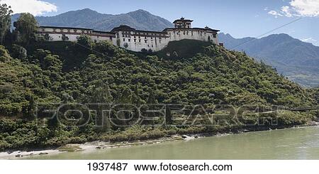 Wangdue Dzong Along The Puntshang Chhu River; Wangdue Phodrang District Bhutan View Large Photo Image Stock Photo - Wangdue Dzong Along The Puntshang Chhu River; Wangdue Phodrang District Bhutan. Fotosearch