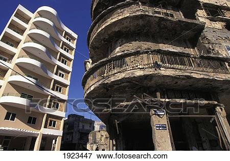 Stock Photo - War Damaged Building & New Building. Fotosearch