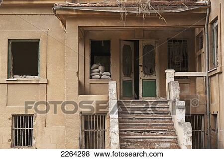 Stock Photo - War-torn building with sandbags in the window in united nations buffer zone; nicosia cyprus. Fotosearch