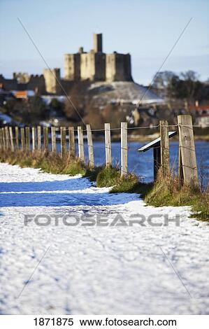Warkworth, Northumberland, England; A Snow Covered Path Along The Water View Large Photo Image Stock Photography - Warkworth, Northumberland, England; A Snow Covered Path Along The Water. Fotosearch