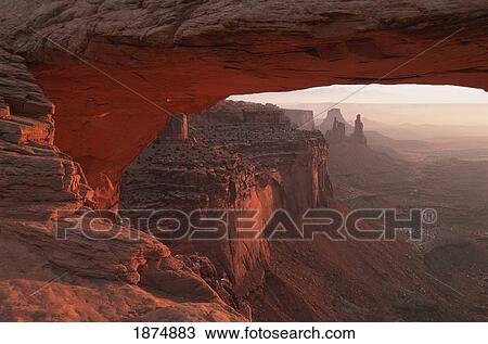 Washer Woman Arch Viewed Through Mesa Arch At Sunrise In Canyonlands National Park; Utah, Usa View Large Photo Image Stock Image - Washer Woman Arch Viewed Through Mesa Arch At Sunrise In Canyonlands National Park; Utah, Usa. Fotosearch