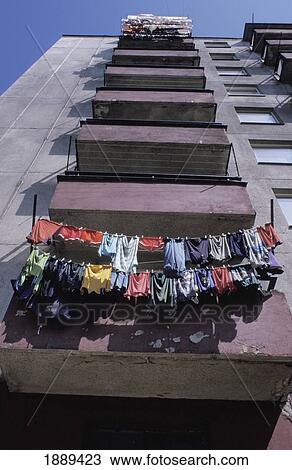 Stock Image - Washing Hanging Out To Dry On A Balcony Of Tower Block. Fotosearch