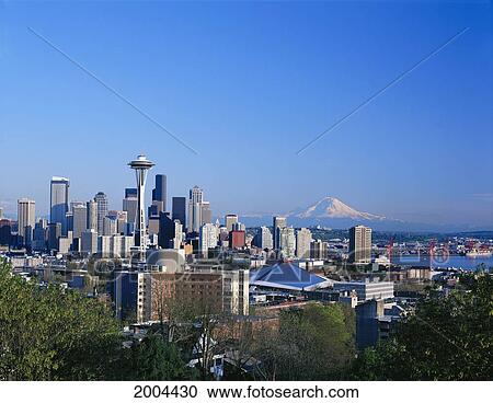 Stock Image - Washington, Seattle Skyline With Space Needle And Snowcapped Mount Hood In Background, Blue Sky. Fotosearch