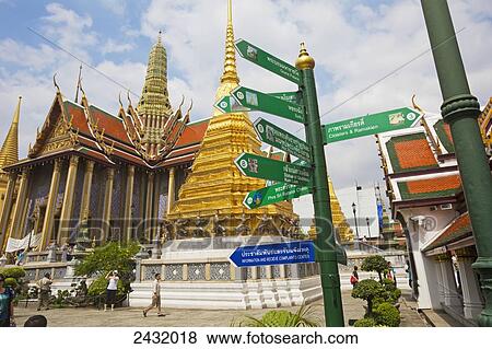 Stock Photo - Wat Phra Kaeo Temple, Royal Palace, Caryatid demonds on a golden chedi, Grand Palace; Bangkok, Thailand. Fotosearch