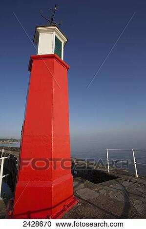 Stock Image - Watchet Harbour and lighthouse; Somerset, England. Fotosearch