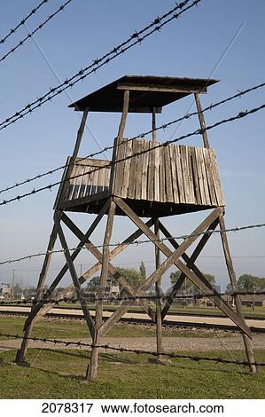 Stock Photo - Watchtower Along The 'selektionsrampe', The Platform Where People Where Selected To Die In The Gas Chambers Immediately Or To Work To Death At The Auschwitz-Birkenau Concentration Camp, Auschwitz-Birkenau Concentration Camp, Oswiecim, Malopolska, Poland. Fotosearch