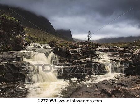 Water Cascading Over Rocks Under Storm Clouds; Applecross Peninsula Scotland View Large Photo Image Stock Photo - Water Cascading Over Rocks Under Storm Clouds; Applecross Peninsula Scotland. Fotosearch