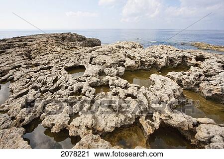 Water-Filled Holes Of The Inland Sea, Dwejra Bay, Gozo Island, Malta View Large Photo Image Stock Image - Water-Filled Holes Of The Inland Sea, Dwejra Bay, Gozo Island, Malta. Fotosearch