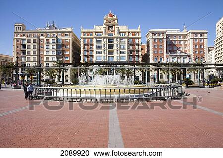 Stock Image - Water Fountain And Buildings; Malaga, Andalusia, Spain. Fotosearch