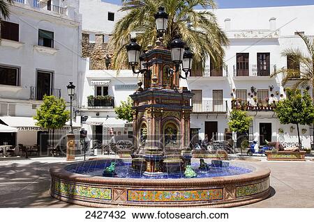 Stock Image - Water fountain in town square; Vejer de la Frontera, Andalusia, Spain. Fotosearch