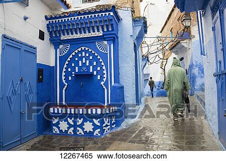 Water fountain with Islamic arch in street scene; Chefchaouen, Morocco View Large Photo Image Stock Photography - Water fountain with Islamic arch in street scene; Chefchaouen, Morocco. Fotosearch