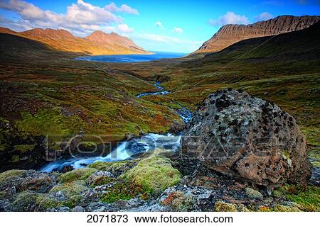 Waterfall And Rock Leading Into The Ocean On The Central Westfjords Of Iceland View Large Photo Image Stock Image - Waterfall And Rock Leading Into The Ocean On The Central Westfjords Of Iceland. Fotosearch