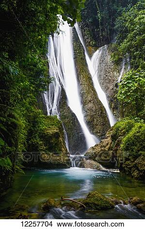Waterfall over moss covered cliff; Tanna Island, Vanuatu View Large Photo Image Picture - Waterfall over moss covered cliff; Tanna Island, Vanuatu. Fotosearch
