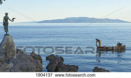 Stock Photo - Waterfront Of Opatija Showing Statue 'girl Holding Seagull' By Zvonko Car, Croatia. Fotosearch