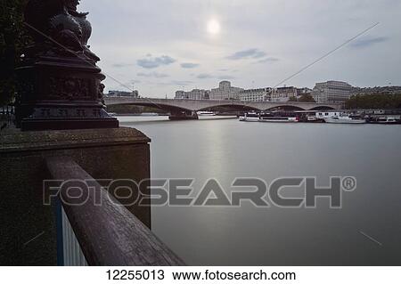 Watery overcast sky and the River Thames passing through Central London; London, England View Large Photo Image Stock Image - Watery overcast sky and the River Thames passing through Central London; London, England. Fotosearch