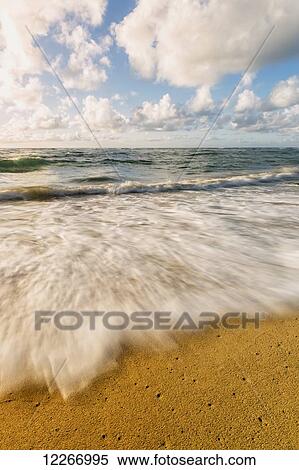 Stock Photography - Wave breaking on shore; Wailua, Kauai, Hawaii, United States of America. Fotosearch