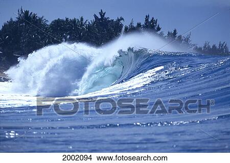 Wave Crashing Near Shoreline, Palm Trees In Background, Shimmery Ocean View Large Photo Image Picture - Wave Crashing Near Shoreline, Palm Trees In Background, Shimmery Ocean. Fotosearch