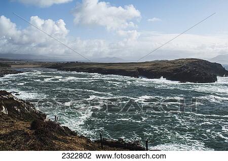 Stock Image - Waves crashing against Bolus Head; Ballinskelligs, Ring of Skelligs, County Kerry, Ireland, UK. Fotosearch