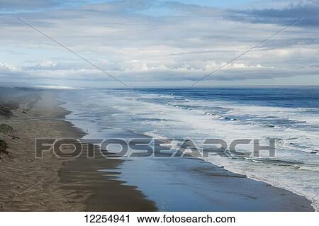 Waves crashing along a beach; Oregon, United States of America View Large Photo Image Stock Image - Waves crashing along a beach; Oregon, United States of America. Fotosearch