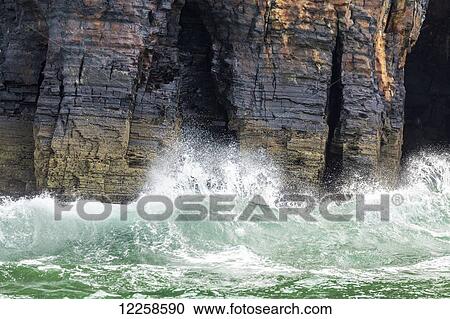 Waves crashing into rock cliffs at water's edge; Ballybunion, County Kerry, Ireland View Large Photo Image Stock Image - Waves crashing into rock cliffs at water's edge; Ballybunion, County Kerry, Ireland. Fotosearch