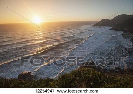 Waves lapping the coast at dusk; Oregon, United States of America View Large Photo Image Stock Photo - Waves lapping the coast at dusk; Oregon, United States of America. Fotosearch