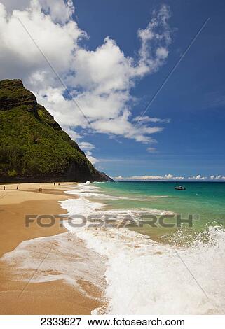 Stock Photo - Waves Splash On This Beach Along The Kalalau Trail And Part Of The Napali Coast; Kauai, Hawaii, United States Of America. Fotosearch