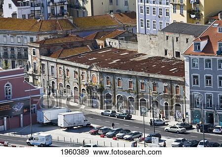 Weathered Old Buildings Along A Road With Parked Cars; Lisbon, Portugal View Large Photo Image Stock Photo - Weathered Old Buildings Along A Road With Parked Cars; Lisbon, Portugal. Fotosearch