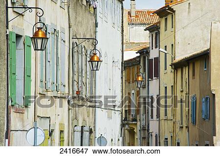 Weathered residential buildings with colourful shutters on the windows; Cite, France View Large Photo Image Stock Photo - Weathered residential buildings with colourful shutters on the windows; Cite, France. Fotosearch