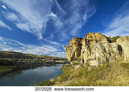 Stock Photograph - Weathered Rocks And Sky Filled With Cirrus Clouds, Writing On Stone Provincial Park, Alberta. Fotosearch